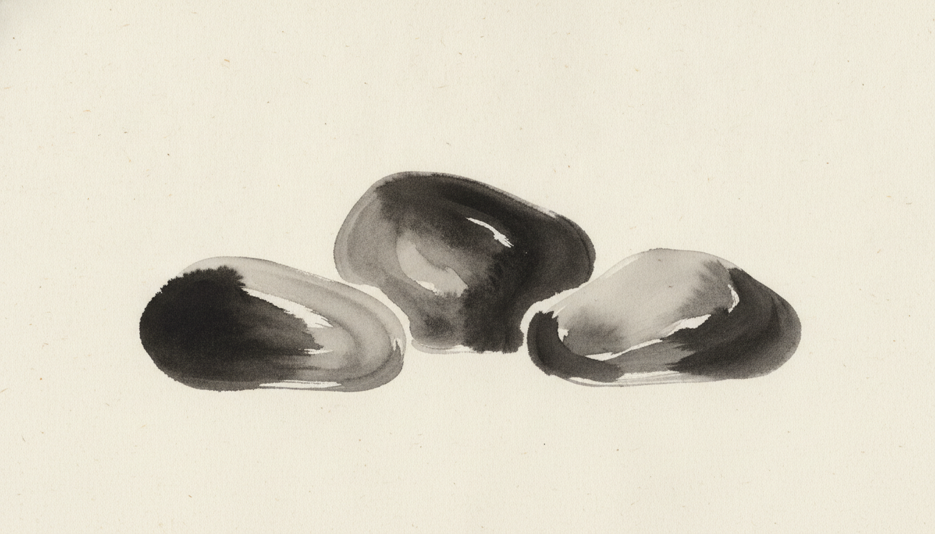 Three river stones clustered together